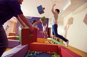 A play area with colorful foam blocks and a ball pit.