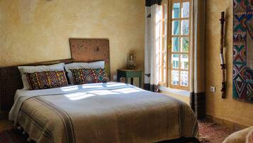 2 bedrooms, blackout drapes, iron/ironing board, rollaway beds