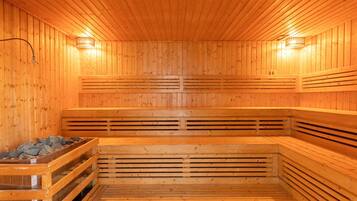 A sauna with wooden walls and benches.