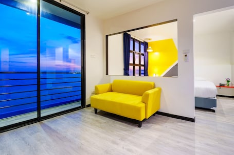 Executive Suite, Sea View | Living area | 32-inch flat-screen TV with cable channels, TV