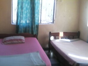 Basic Quadruple Room, 2 Double Beds, Non Smoking | Blackout drapes, iron/ironing board, WiFi, bed sheets - Ubuntu humanity Trust (Livingstone)