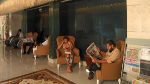 A lobby with seating areas and a magazine rack. - Phoenicia Hotel (Dubai)