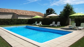 Outdoor pool, open 9 AM to 9 PM, pool umbrellas, pool loungers