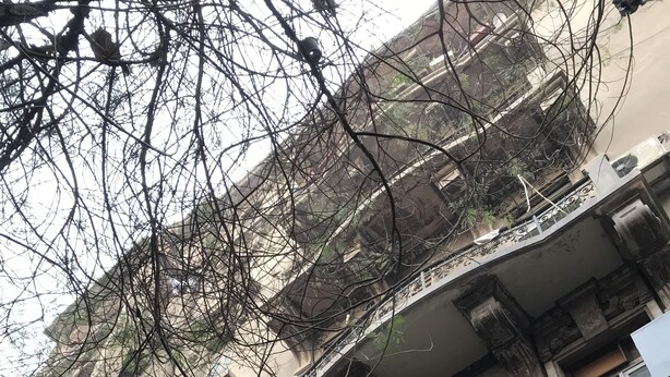 A multi-story building with ornate balconies and intricate architectural details. - Hotel Velvet 1928 (Cairo)