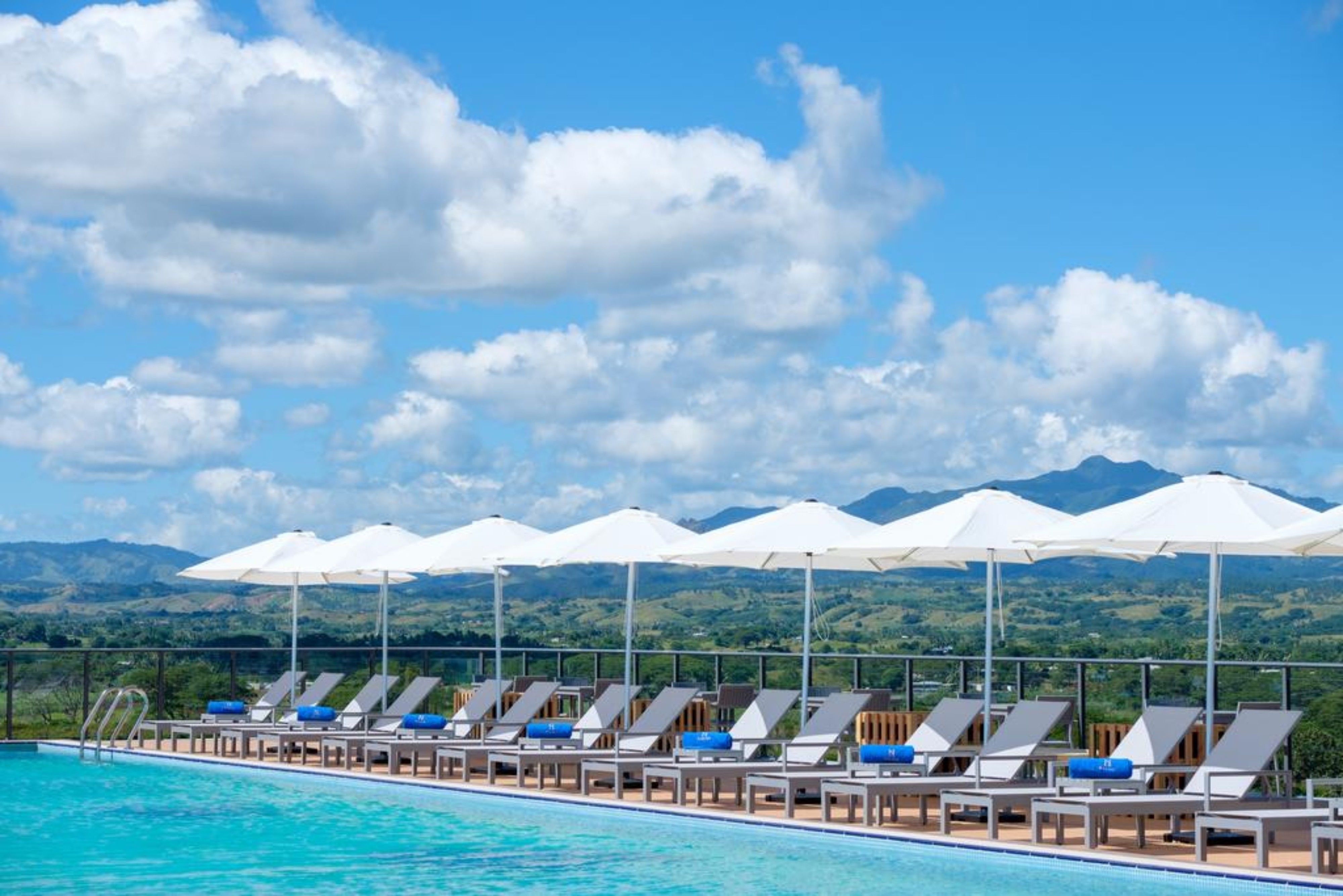 Outdoor pool, open 8:00 AM to 8:00 PM, pool umbrellas, pool loungers