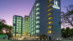 A multi-story hotel with a prominent 'N' sign on the facade, indicating the brand.