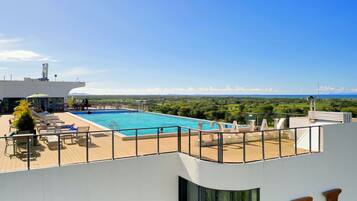 Outdoor pool, open 8:00 AM to 8:00 PM, pool umbrellas, pool loungers