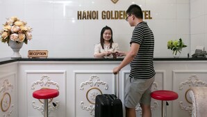 A reception desk at Hanoi Golden Hotel with a sign indicating the reception area. - Hanoi Golden Hotel (Hanoi)