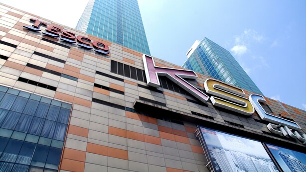 A building with a large 'TESCO' sign and a 'K' logo, indicating a TESCO store. - D'Esplanade City View Apartment (Johor Bahru)