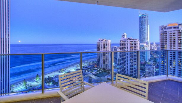 A balcony with a view of the ocean and city skyline. - Orchid - Private Apartments (Surfers Paradise)