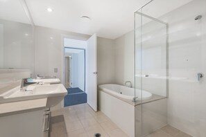 Elite Apartment, 3 Bedrooms, Ocean View | Bathroom | Separate bathtub and shower, deep-soaking bathtub, towels, toilet paper