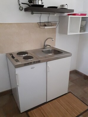 Habitación familiar, baño compartido | Cocineta privada