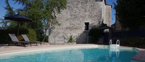 Seasonal outdoor pool, open 10 AM to 9:00 PM, pool umbrellas