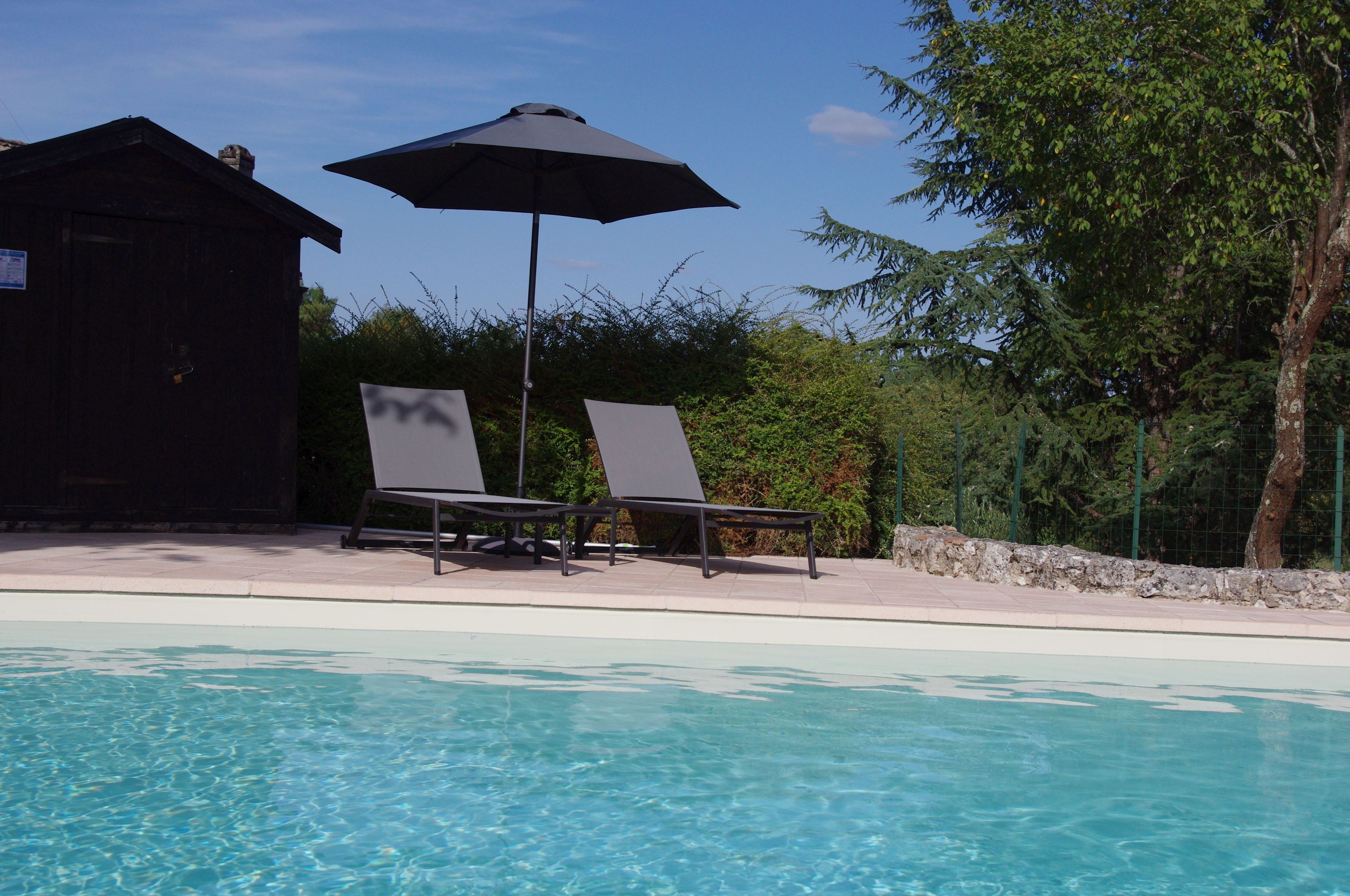 Seasonal outdoor pool, open 10 AM to 9:00 PM, pool umbrellas