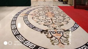 A lobby with a marble floor, a reception desk, and a staircase. - VANHONG Hotel (Guangzhou)