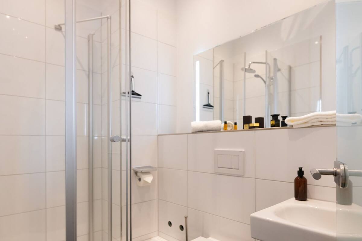 comfort double room | bathroom | shower, rainfall showerhead, hair dryer, towels