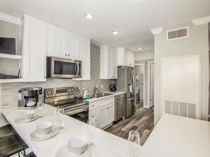 Condo, 2 Bedrooms | Private kitchen | Fridge, microwave, oven, dishwasher