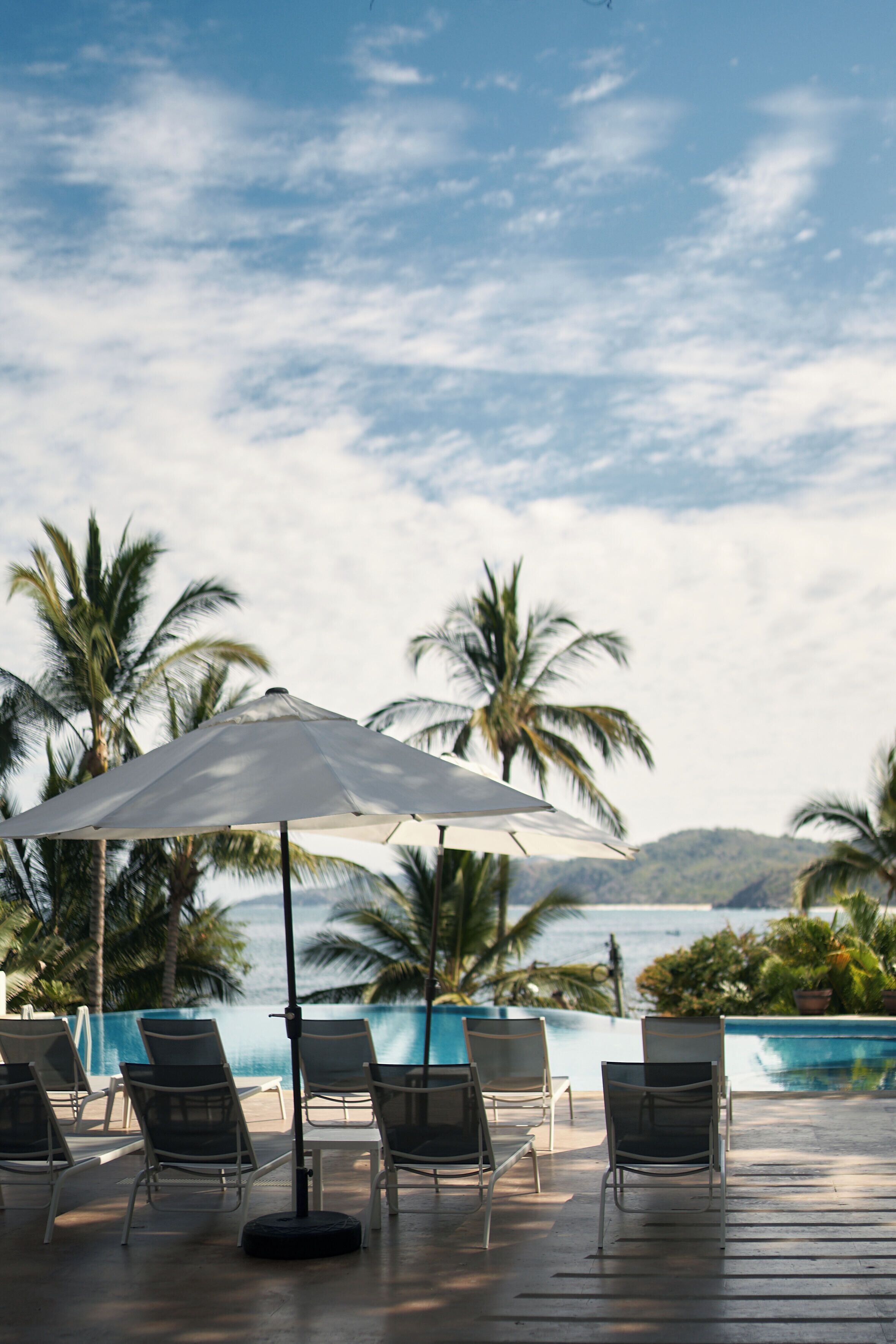 outdoor pool, pool umbrellas, pool loungers