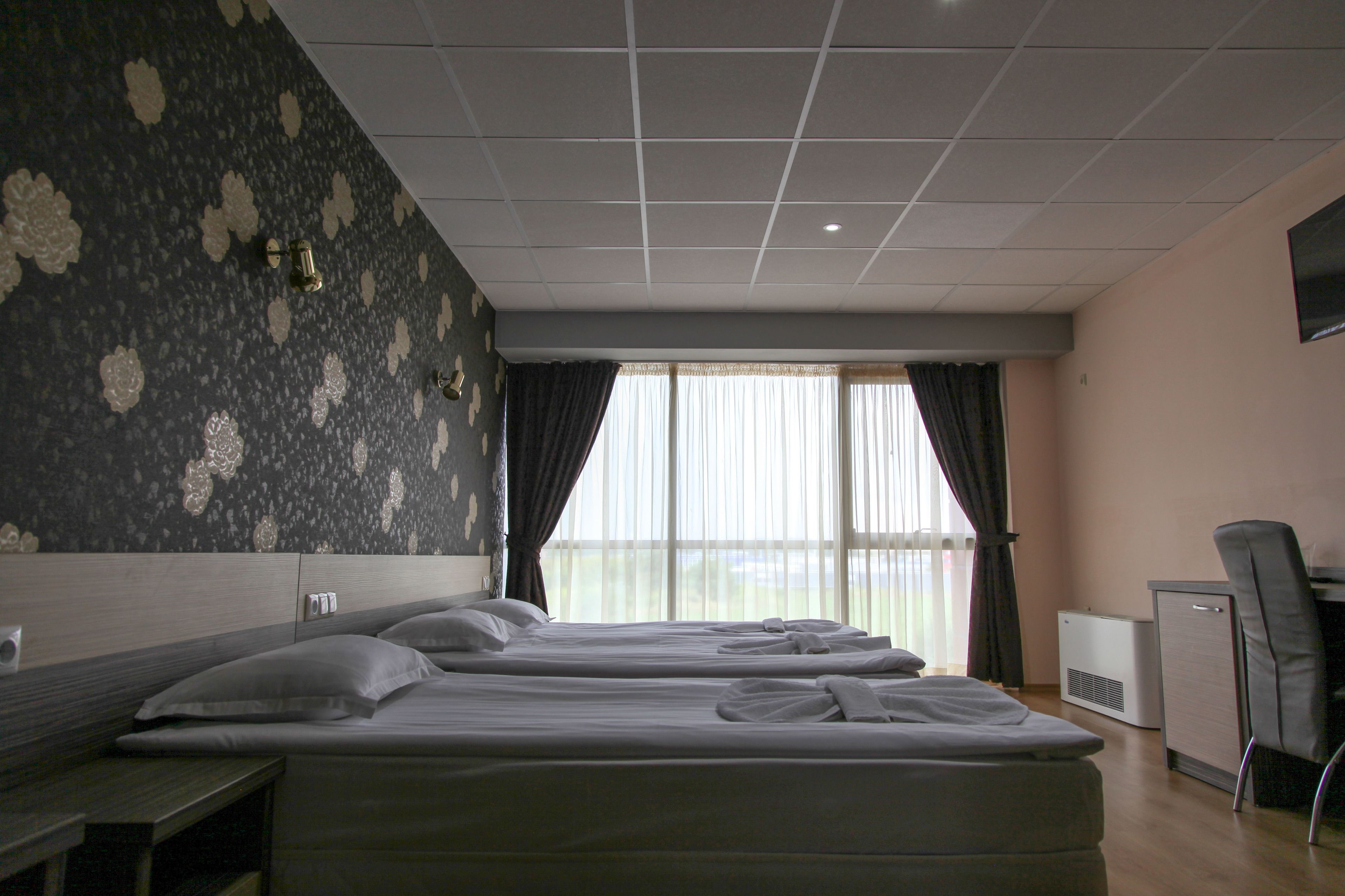 comfort triple room, city view | premium bedding, individually decorated, desk, laptop workspace