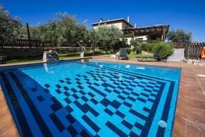 Seasonal outdoor pool, pool loungers