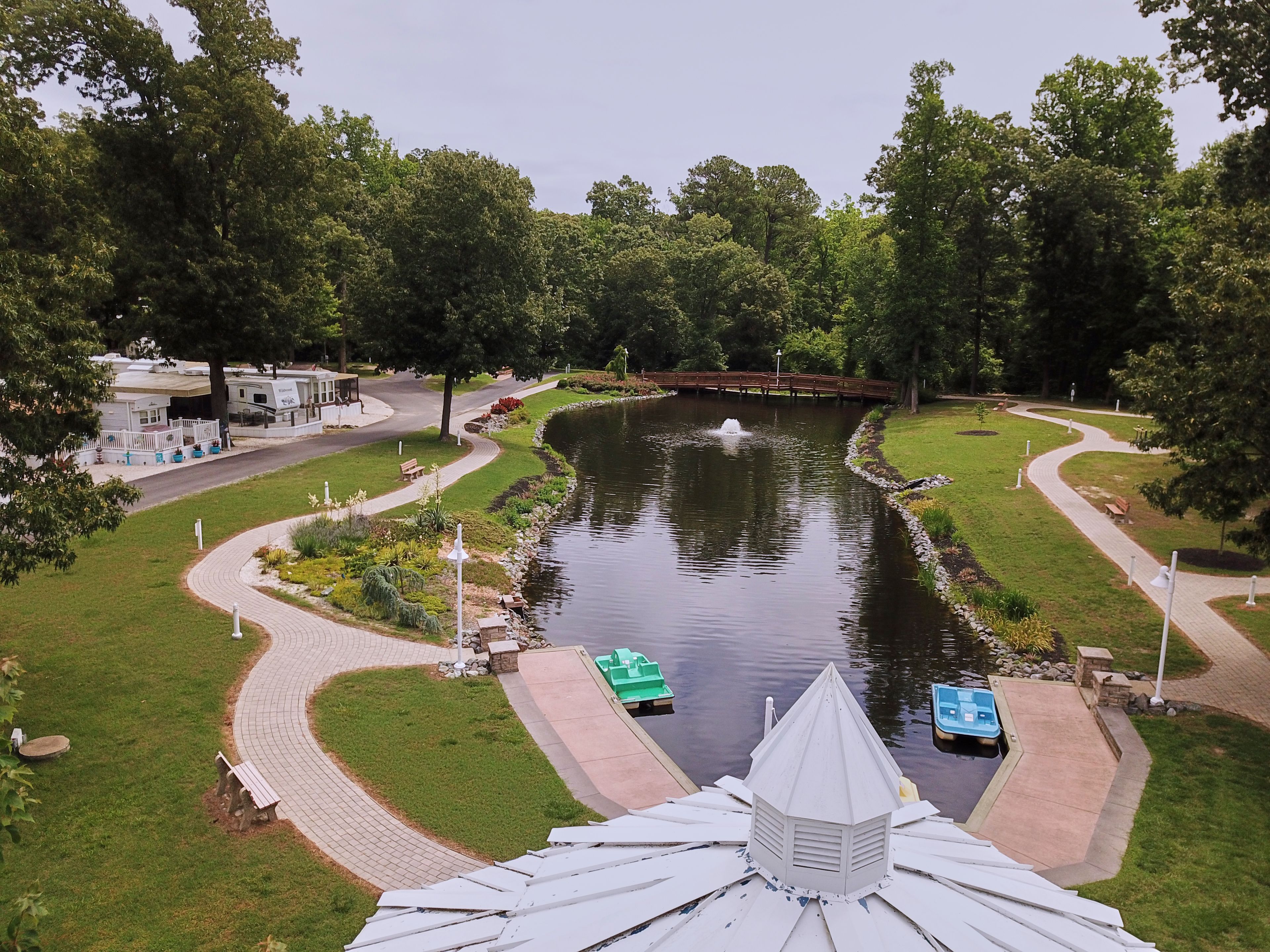 A park with a pond, walking paths, and a gazebo.