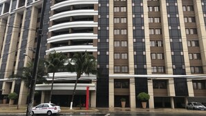 A multi-story building with a modern architectural design, featuring a series of balconies and large windows. - Rede Concept Hotel Salvador (Salvador)