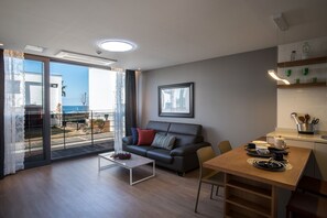 Superior Villa, Partial Ocean View | Living area | 40-inch flat-screen TV with cable channels, TV, heated floors - Aewol Bada Town House (Jeju City)