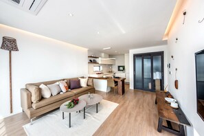 Superior Villa, Ocean View | Living area | 40-inch flat-screen TV with cable channels, TV, heated floors - Aewol Bada Town House (Jeju City)