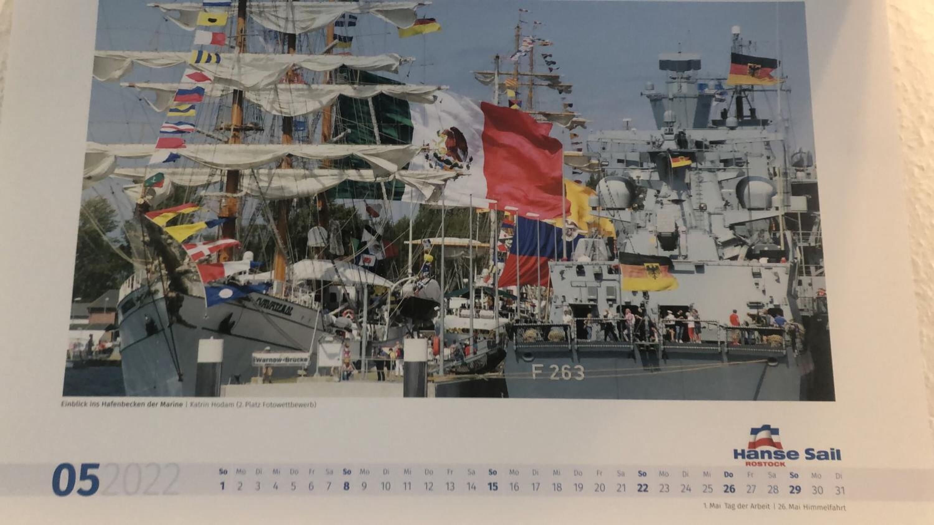 A calendar with a photo of a shipyard.