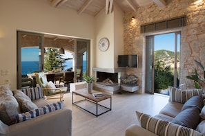Luxury Villa, 4 Bedrooms, Private Pool, Sea View | Living room | Flat-screen TV, fireplace, DVD player - Villa Theoni (Lefkada)