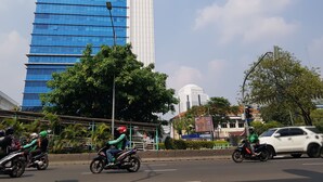 A modern building with a blue facade and a white section. - Hotel Royal Juanda (Jakarta)