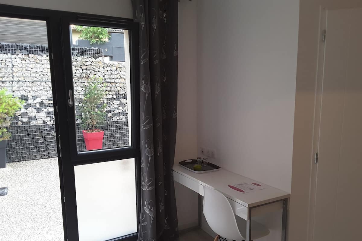 Desk, laptop workspace, blackout drapes, soundproofing