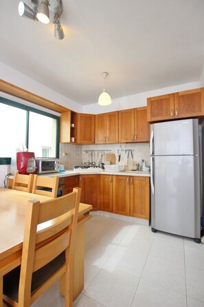 Luxury Apartment, Multiple Beds, Non Smoking, City View | Private kitchen | Oven, stovetop, dishwasher, electric kettle