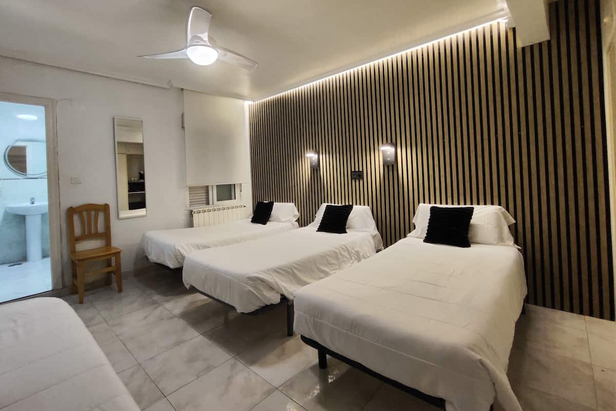 Desk, laptop workspace, free WiFi, bed sheets
