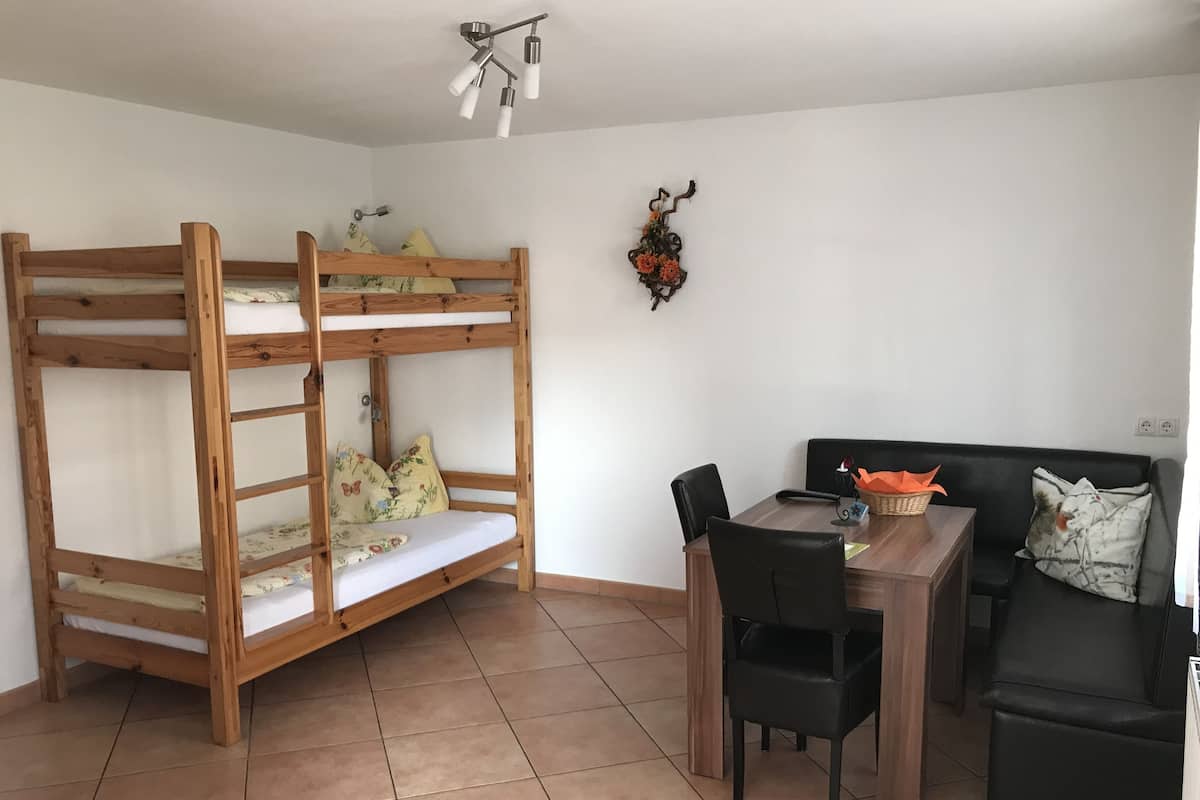 Apartment (FeWo 3) | Living area | Flat-screen TV