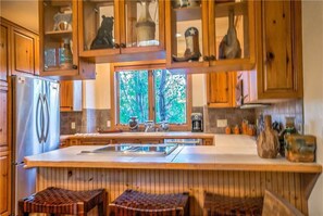 Microwave, stovetop, dishwasher, cookware/dishes/utensils