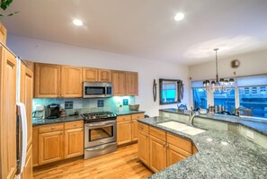 Dishwasher, coffee/tea maker, dining tables, kitchen islands