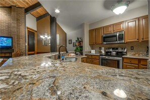 Stovetop, dishwasher, cookware/dishes/utensils, dining tables - Lodge A 301 (Steamboat Springs)