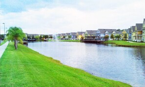 A riverside residential area with houses along the water. - Sm215691 - Venetian Bay - 3 Bed 2 Baths Townhome (Kissimmee)
