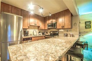 Stovetop, dishwasher, cookware/dishes/utensils, dining tables - Storm Meadows 445 (Steamboat Springs)