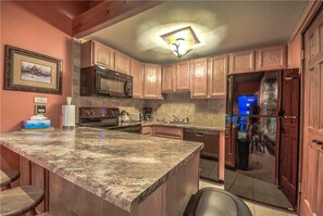 Stovetop, dishwasher, cookware/dishes/utensils, dining tables - Storm Meadows C 317 (Steamboat Springs)