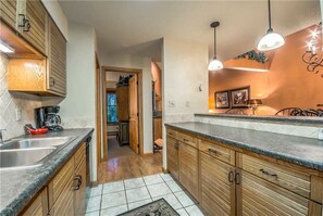 Stovetop, dishwasher, cookware/dishes/utensils, dining tables - Timber Run 111 (Steamboat Springs)