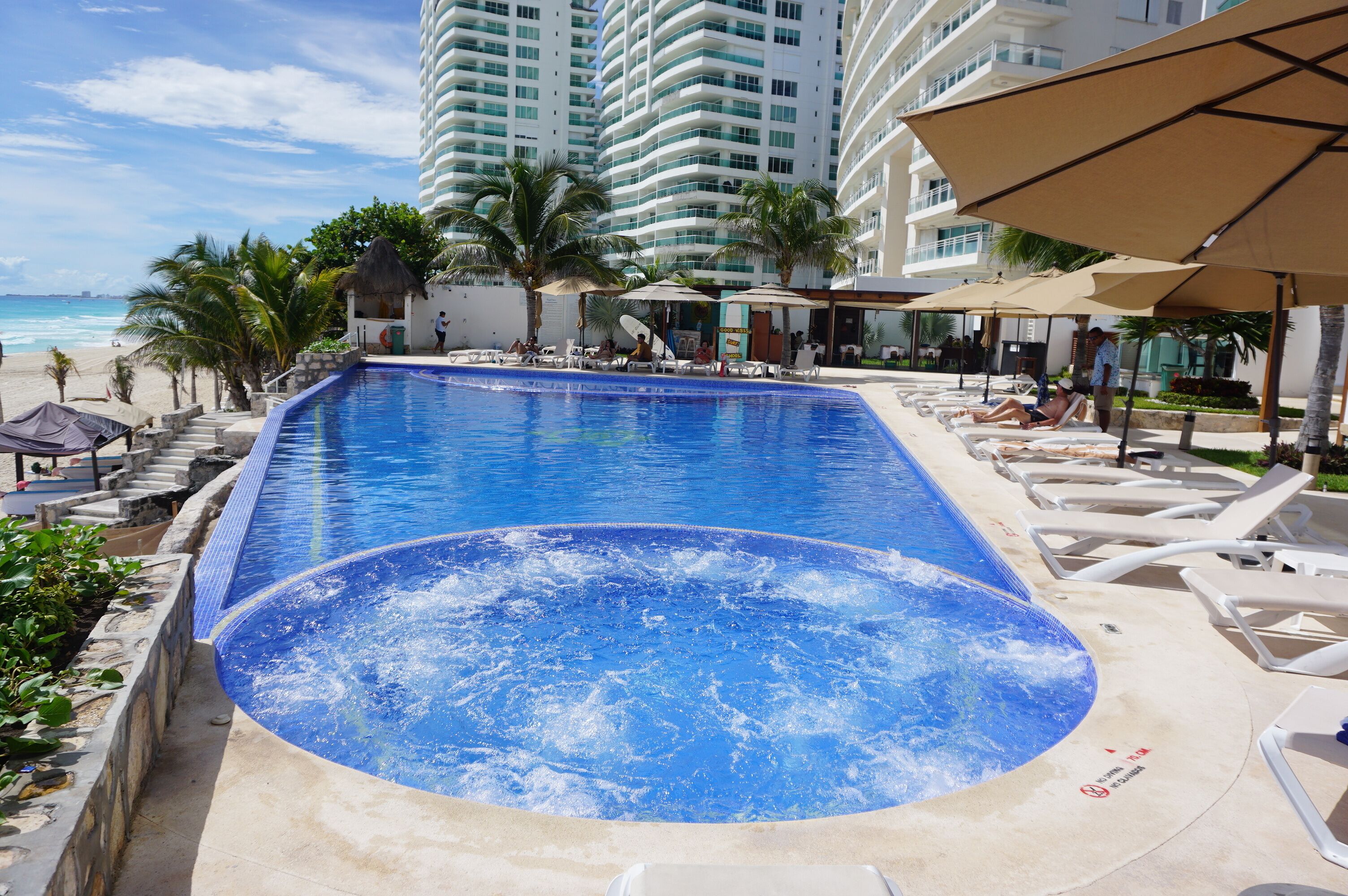 2 outdoor pools, open 9 AM to 9 PM, pool umbrellas, pool loungers