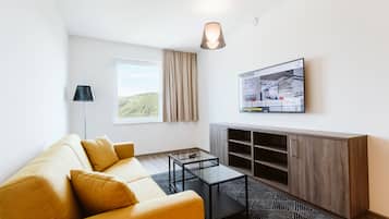 Suite, 1 Bedroom | Living area | 50-inch Smart TV with digital channels, TV