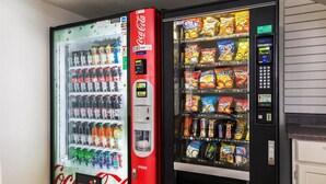 A vending machine with Coca-Cola and a snack vending machine. - Studio 6 Alexandria, LA (Alexandria)