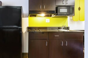 Full-size fridge, microwave, stovetop, coffee/tea maker