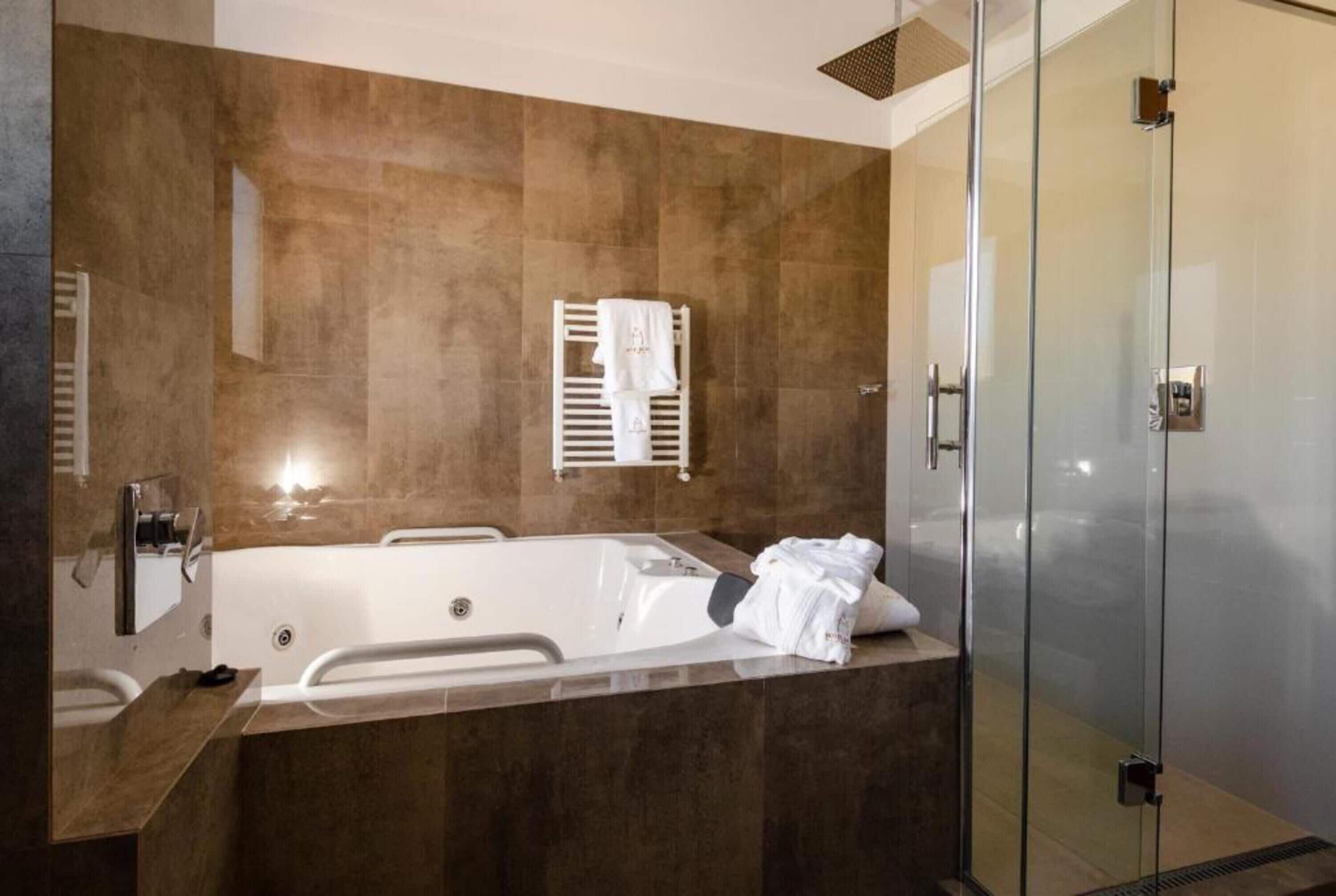 mitru suite | bathroom | shower, free toiletries, hair dryer, towels