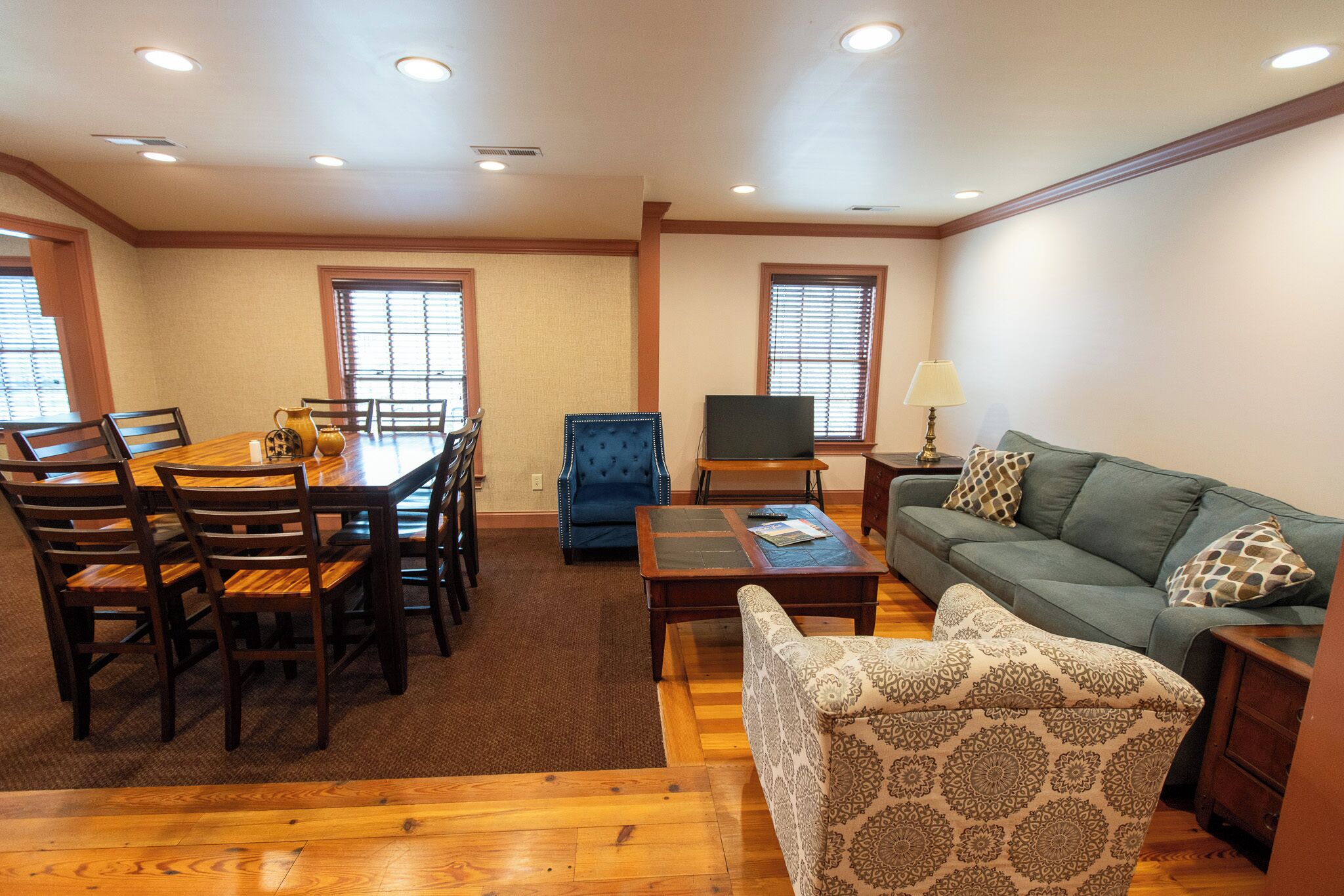 elite apartment, multiple beds, non smoking | living area | flat-screen tv