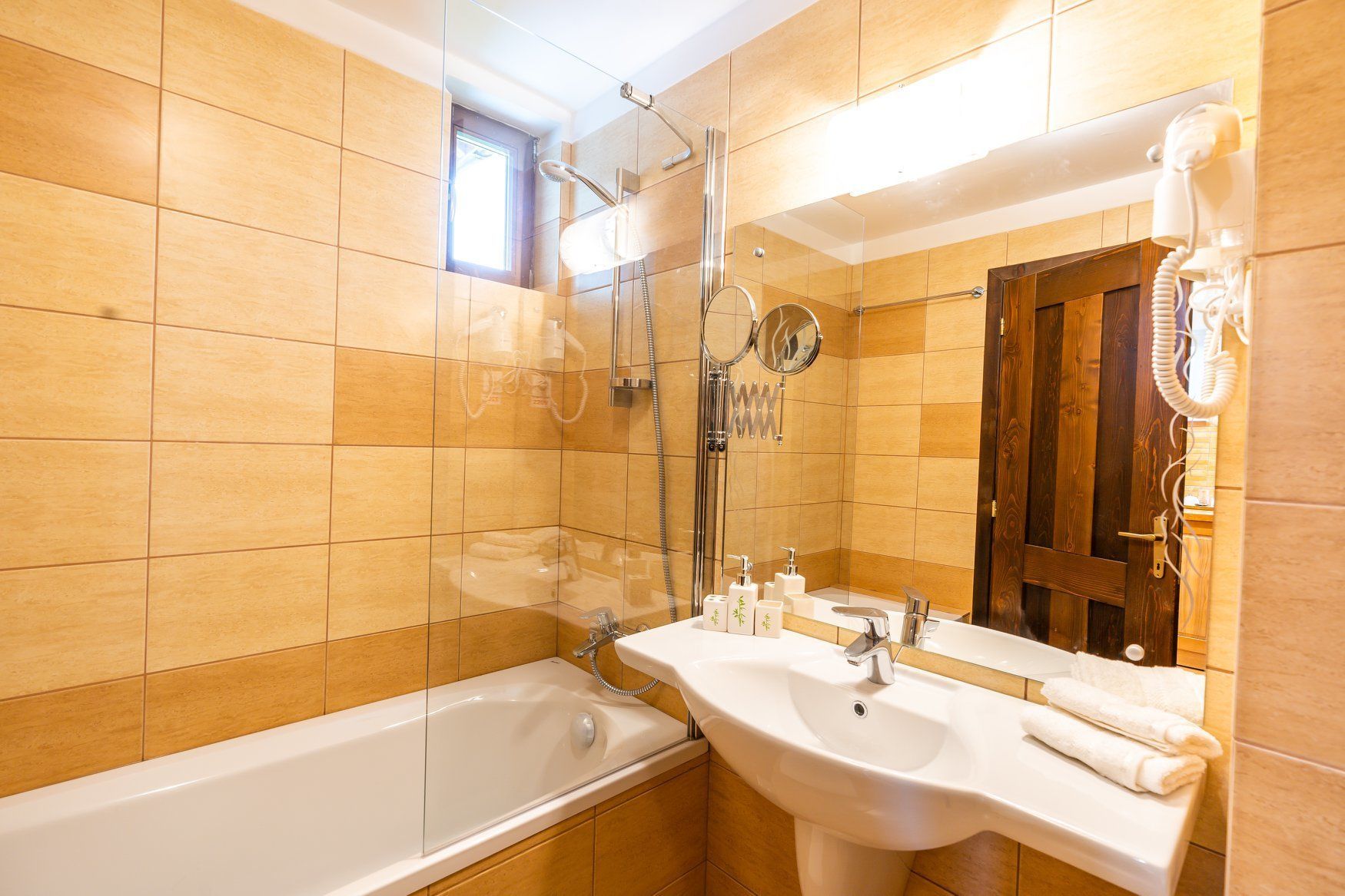 A bathroom with a bathtub, a sink, and a shower.