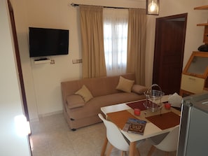 Deluxe Apartment, 2 Bedrooms, Mountain View | Living area | Flat-screen TV